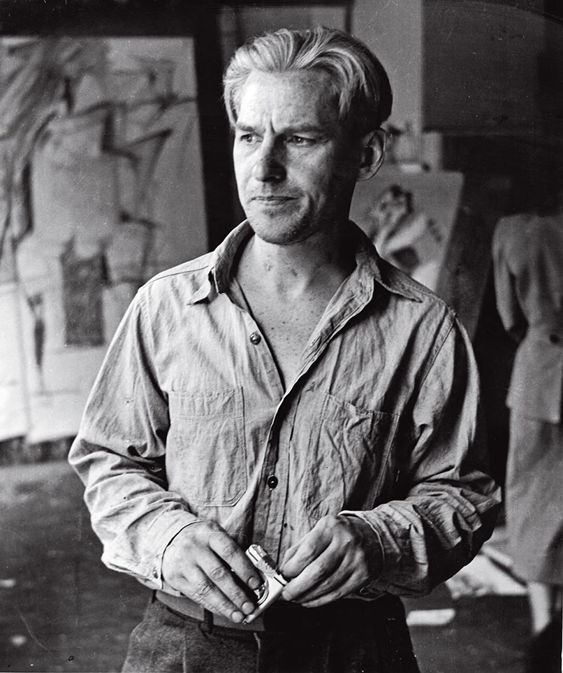 Willem de Kooning in his Fourth Avenue studio with drawings related to Woman I in the background, 1950; photograph by Rudy Burckhardt.
