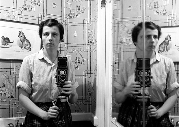 Vivian Maier takes one of her many blurry and distorted self-portraits, date unknown
