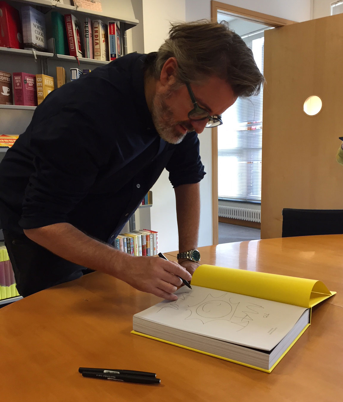 Olafur Eliasson signing copies of Experience at Phaidon