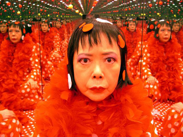 Yayoi Kusama in one of her mirror rooms, 2004